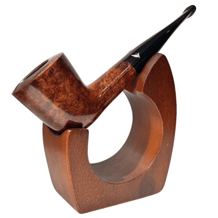 The Fenice Mogano SB Dublin is a sophisticated take on a timeless classic, crafted with the precision and elegance that defines Italian pipe-making. Shaped with a slight forward taper and a flared bowl, this Dublin-style pipe offers a comfortable grip and a focused draw that enhances flavor with every puff