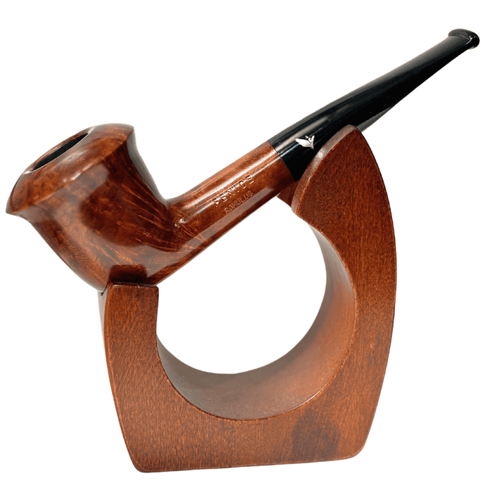 The Fenice Mogano St. Tulip is a beautifully sculpted pipe that blends graceful curves with refined Italian craftsmanship. Featuring a tulip-shaped bowl that gently flares at the rim, this pipe offers a comfortable grip and an elegant silhouette