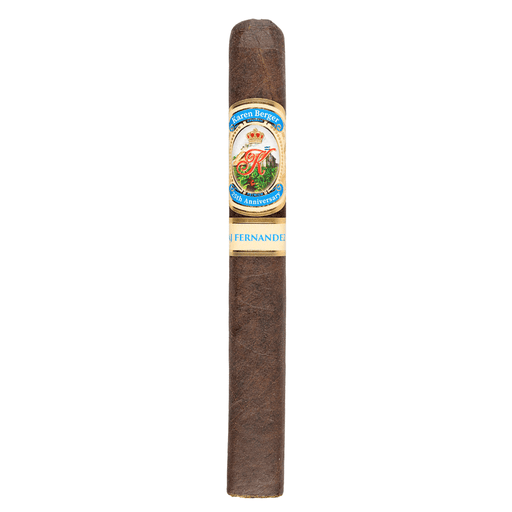 Karen Berger 25th Anniversary by AJ Fernandez Toro cigar standing upright against a white background, showcasing its dark brown Ecuadorian Habano wrapper and detailed gold, blue, and white band with the Karen Berger crest and “25th Anniversary” label