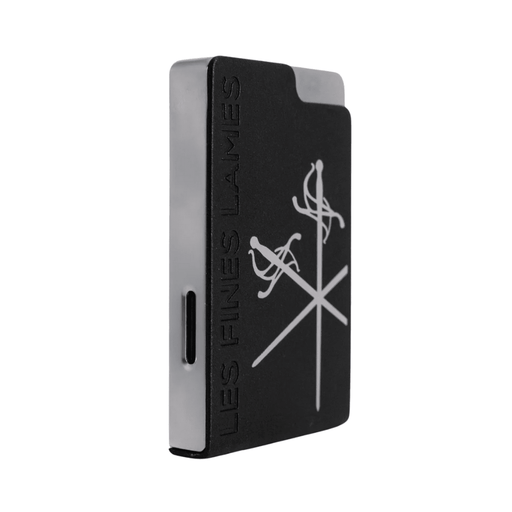 Les Fines Lames Le Feu Brick Lighter with a solid rectangular body and single flame torch displayed on a plain white background.