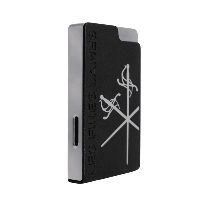 Les Fines Lames Le Feu Brick Lighter with a solid rectangular body and single flame torch displayed on a plain white background.