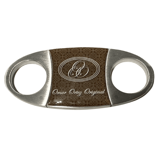 Omar Ortez steel cigar cutter with stainless steel blades and brown center panel displayed on white background