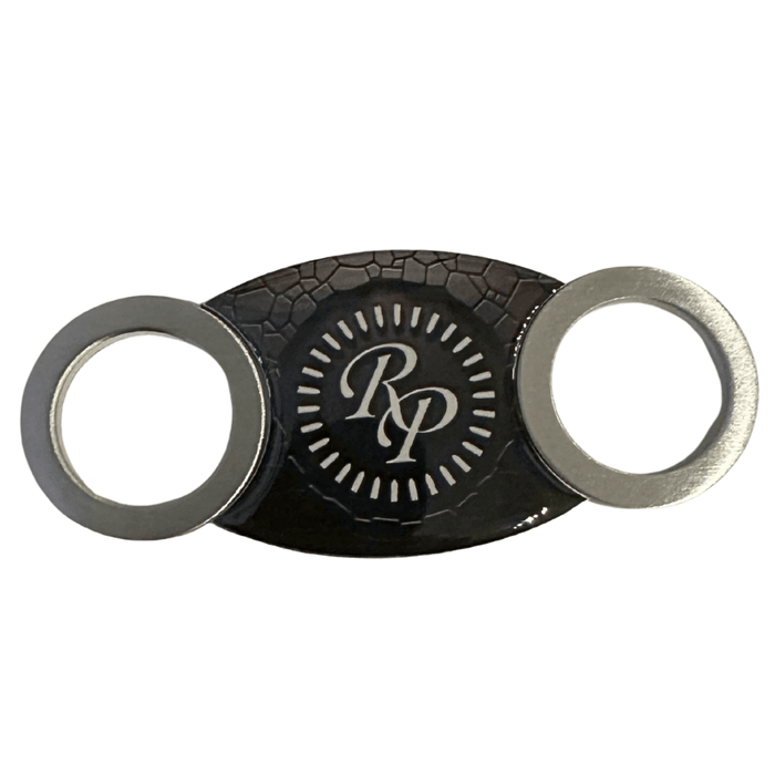 Rocky Patel steel cigar cutter black with stainless steel blades and RP logo center on white background